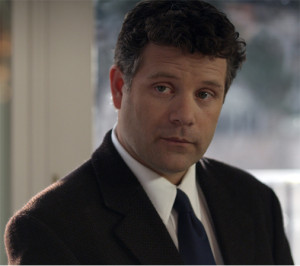 Sean Astin as detective Leon Weed in the film The Freemason