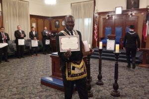 DGM Michael T. Anderson Shows His Certificate Of Honorary Membership In Jewel P. Lightfoot Lodge